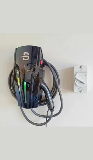 Mounted on the wall is the black ZJ Beny EV chargr