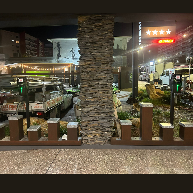 Two black EV charging unit installed on an outside setting