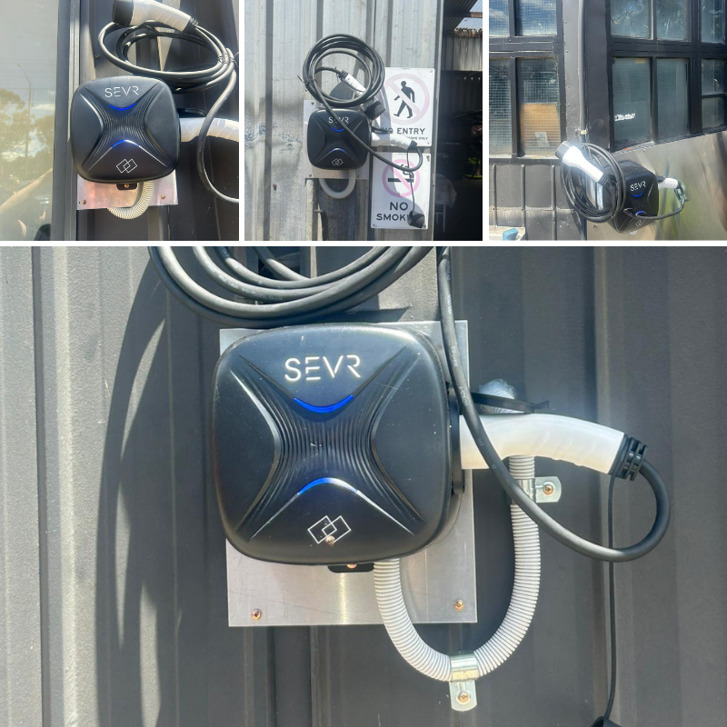 SEVR electric vehicle charging station mounted on a wall