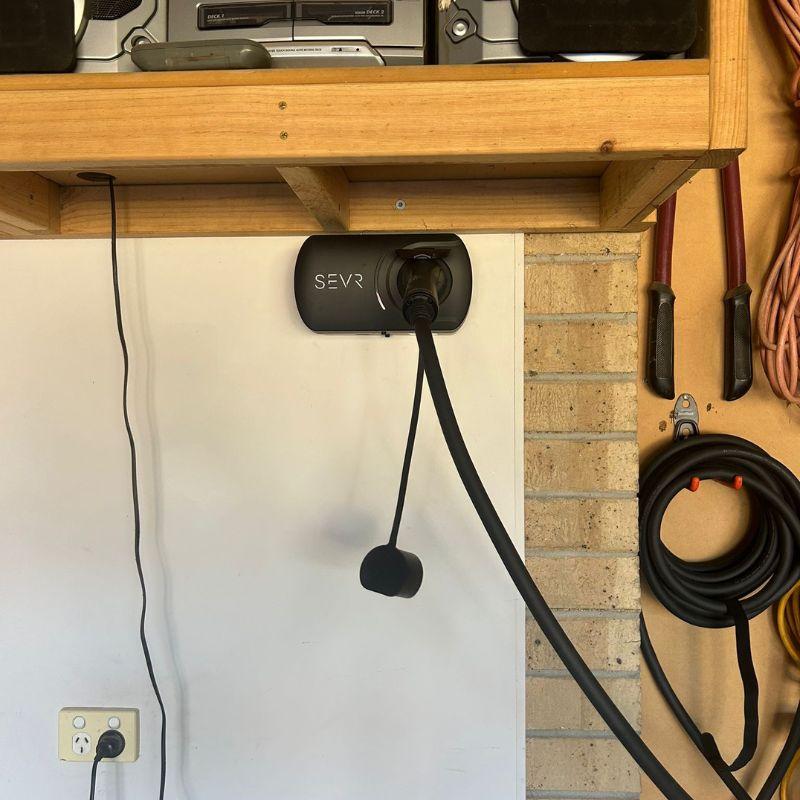 SEVR EV charging station attached to a white wall