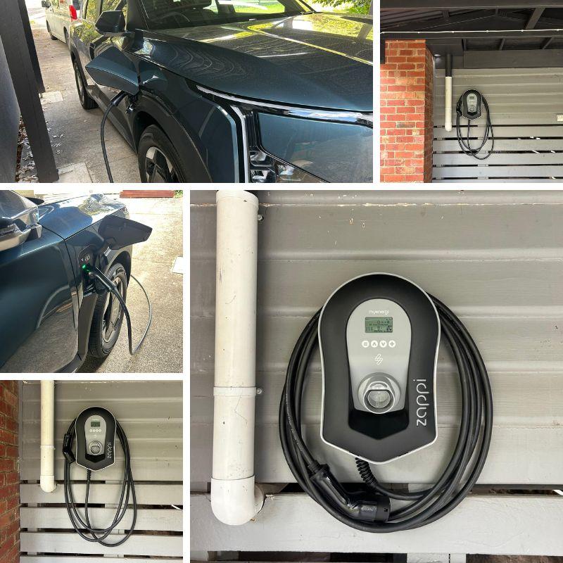 Black Zappi EV charger attached to a wall