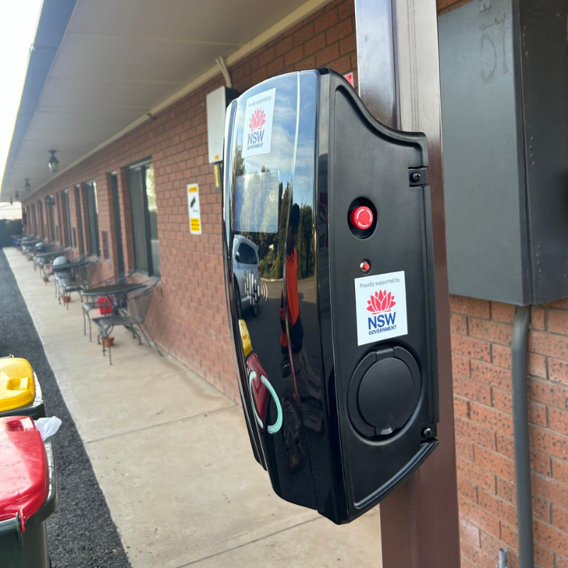 black ev charging device on a pole