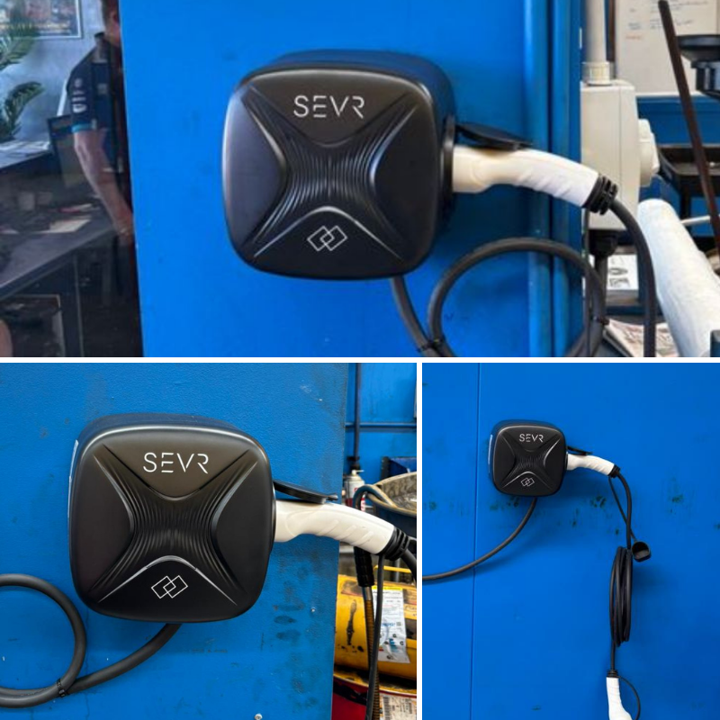 SEVR electric vehicle charging station on a blue wall