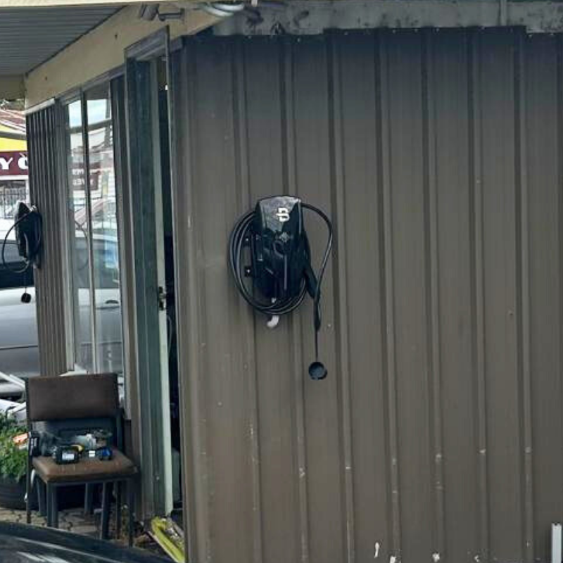 Wall-mounted black EV charger 