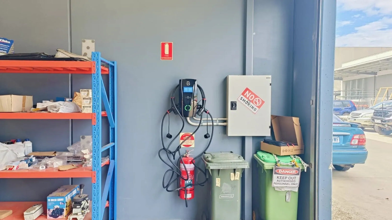 installed inside the garage is a black ev charging unit