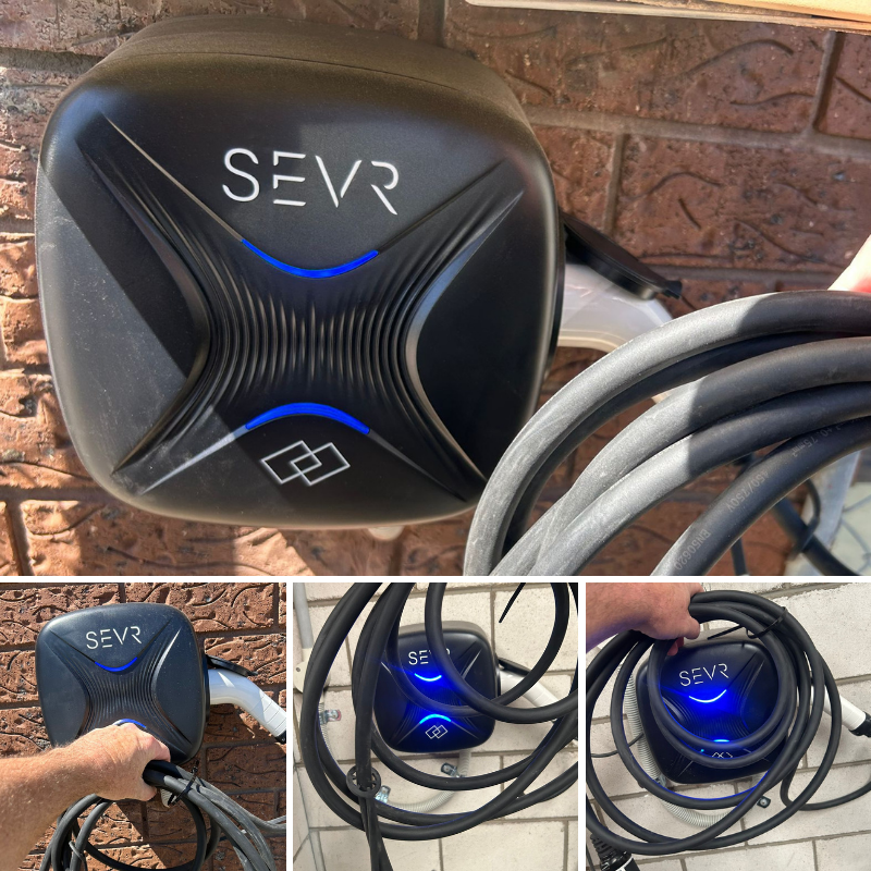 SEVR electric vehicle charging station on a brick wall.