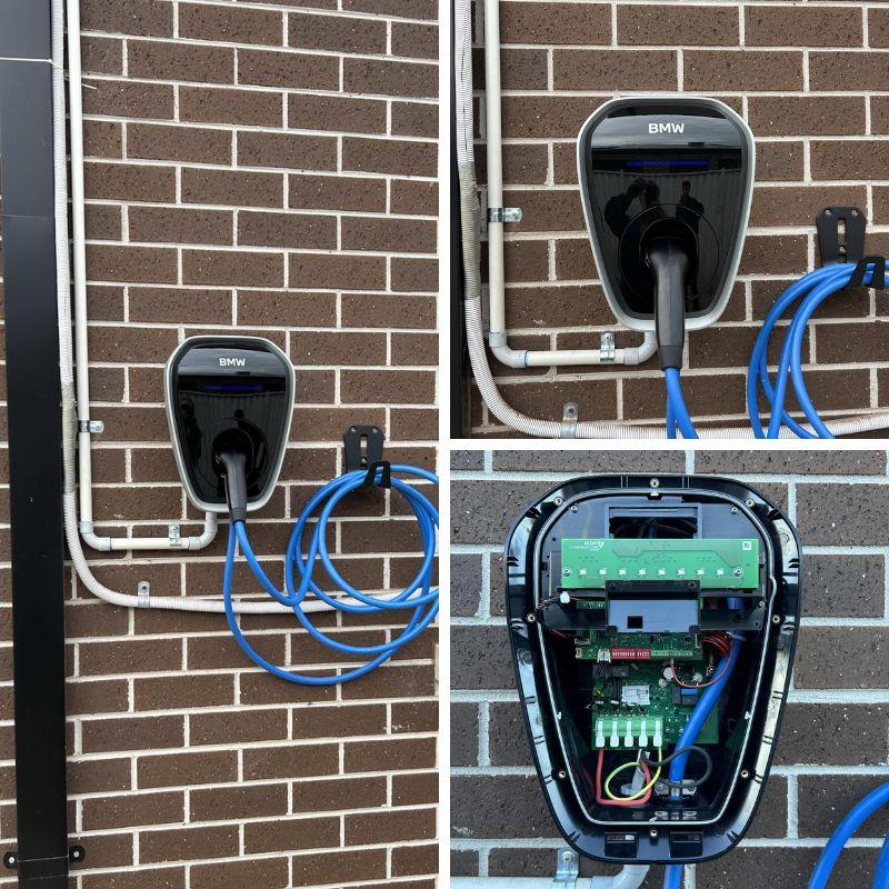 BMW electric vehicle charging station mounted on a brick wall.