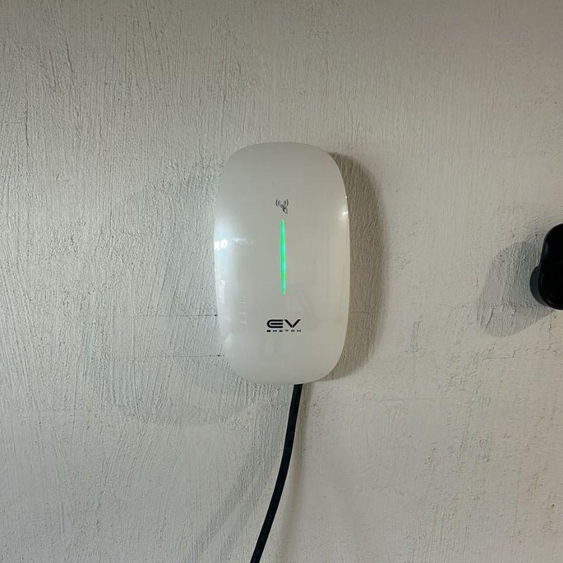 White EV switch EV charger mounted on a wall