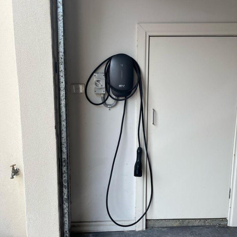 EV switch electric vehicle charging station mounted on a wall 