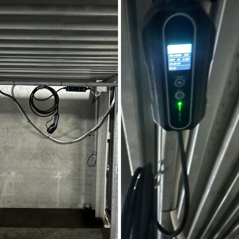 black electric vehicle charging station in a garage