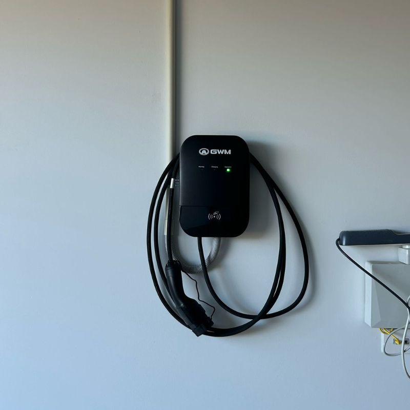 GWM black electric vehicle charging attached to a wall 
