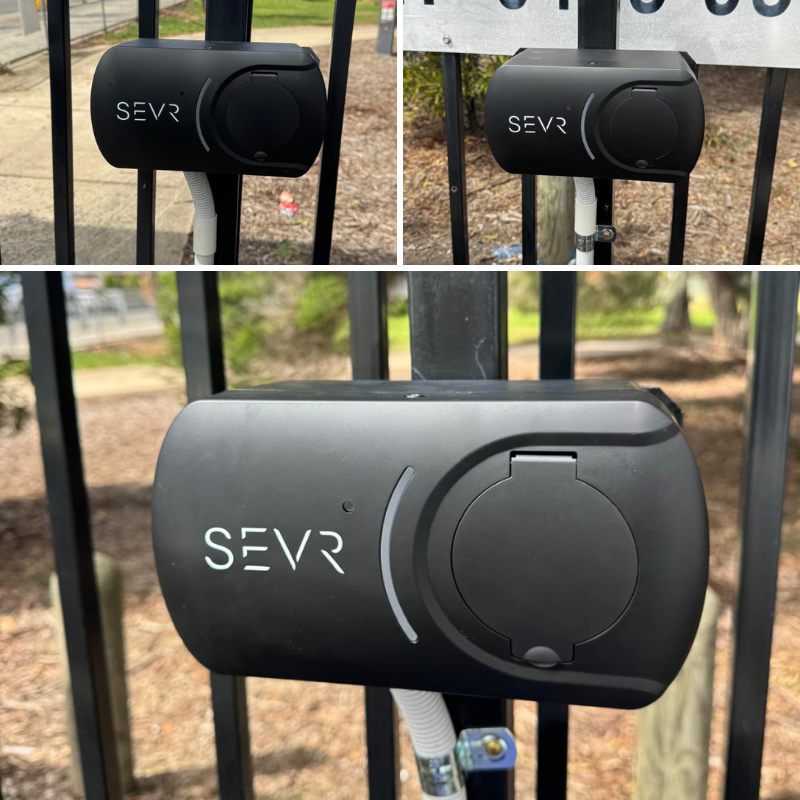 Black SEVR device attached to a metal fence