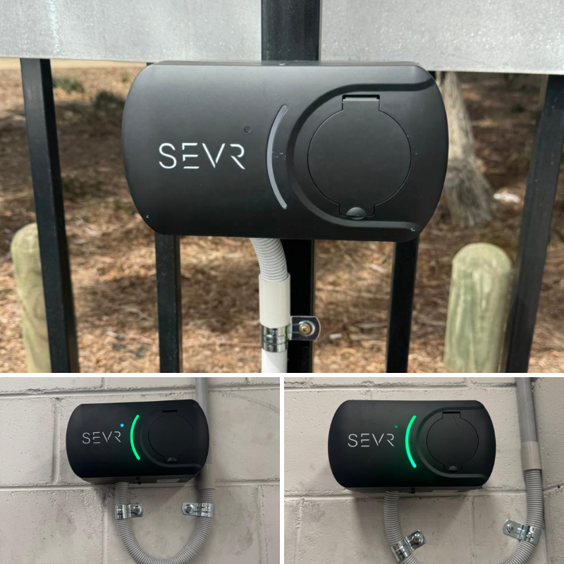SEVR ev charger on a fence and brick wall