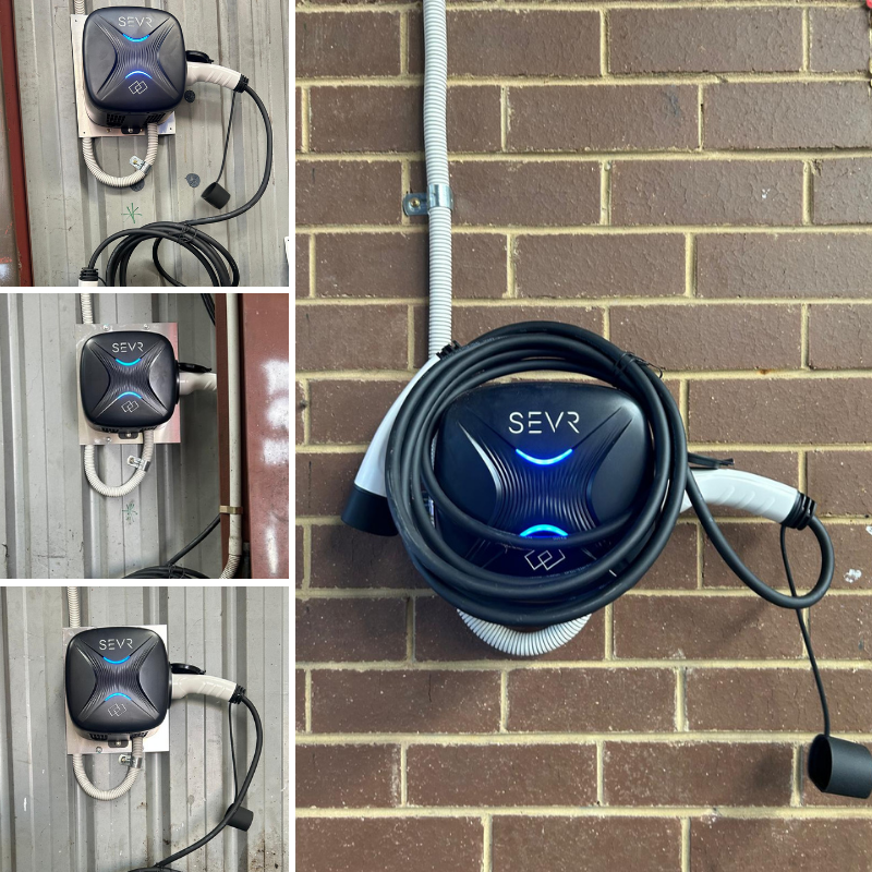 SEVR electric vehicle charging station mounted on a brick wall 