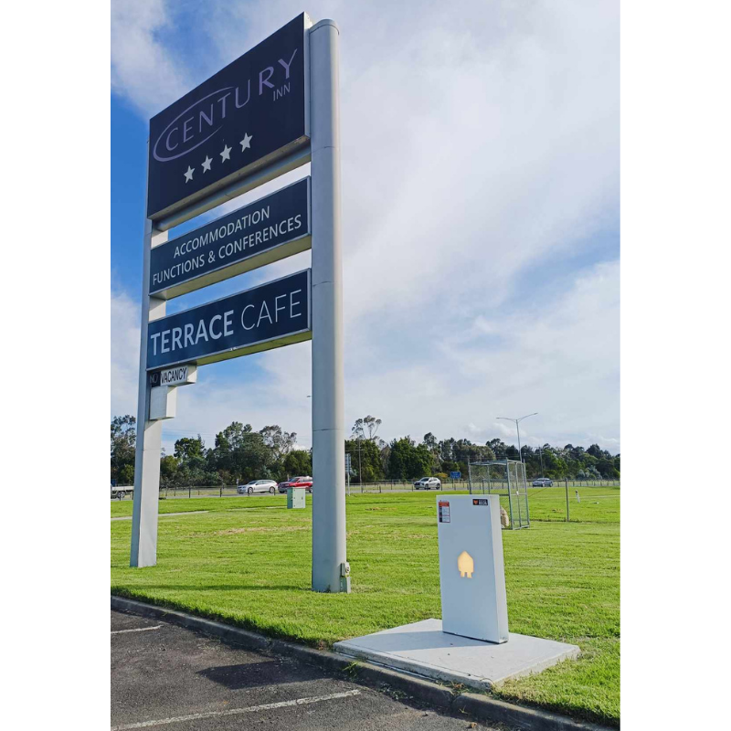 White Smapee ev charger installed outside Century Inn