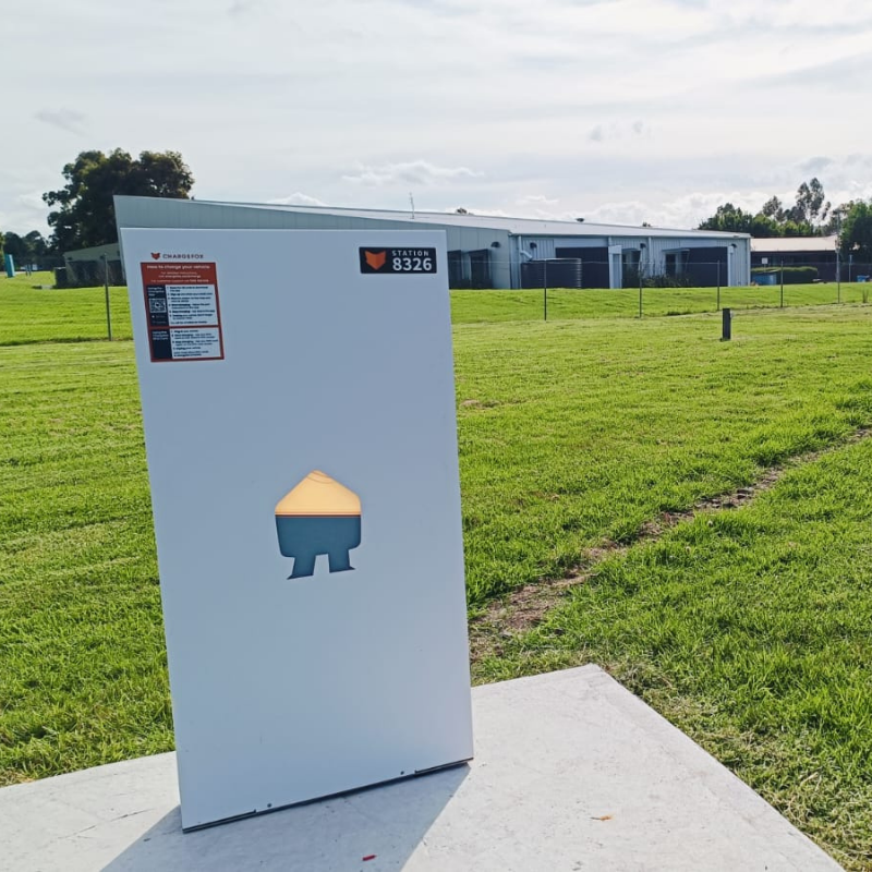 White Smapee EV charger installed on an outdoor setting