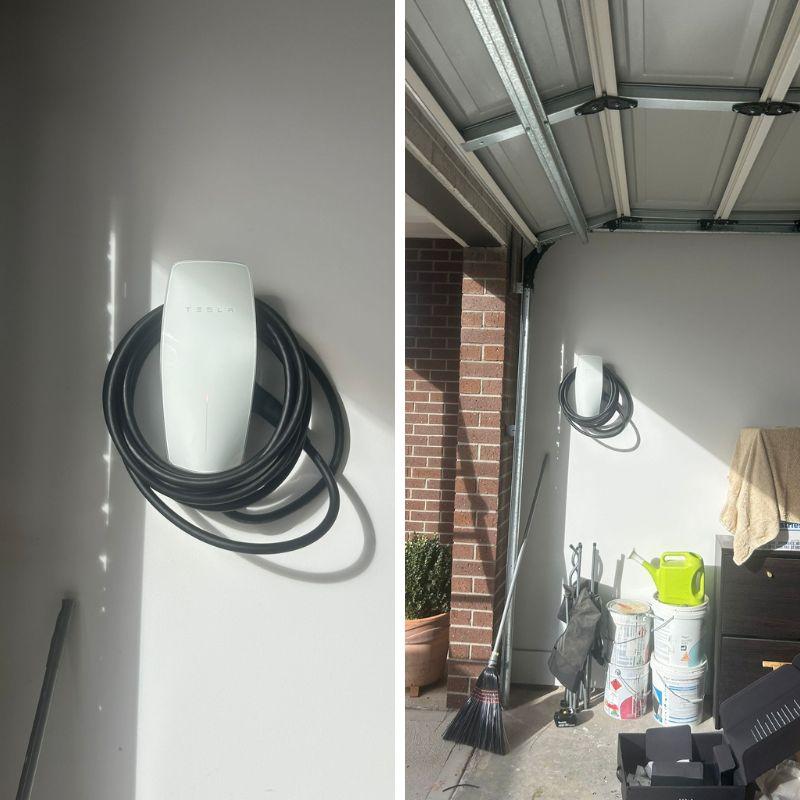 White Tesla wall charger attached to a wall